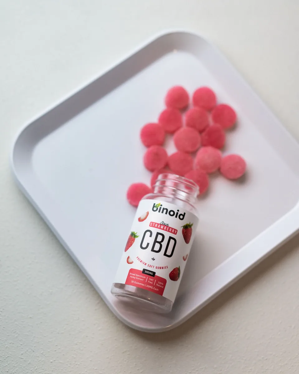 Sour strawberry CBD gummies on a tray